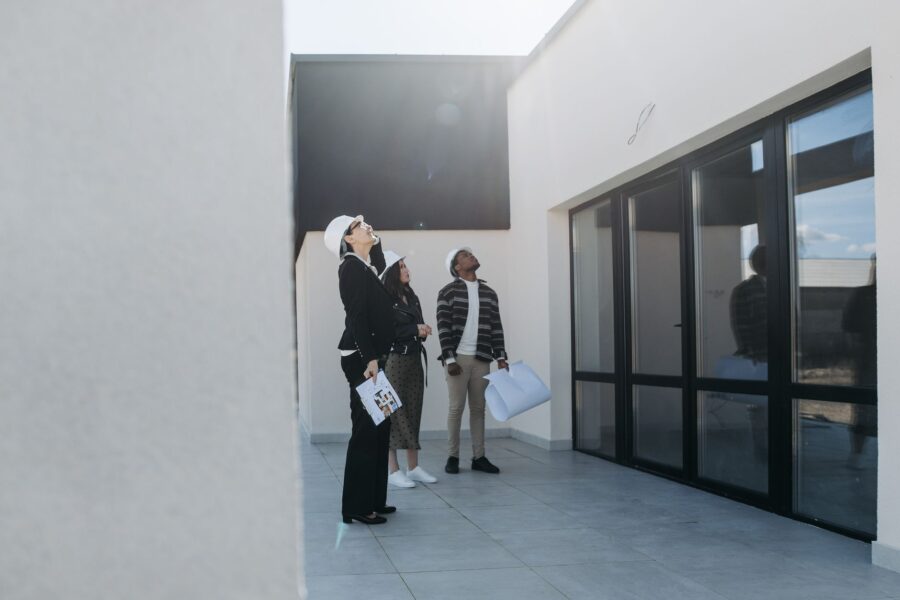 home appraisal Kenya - Home appraiser inspecting a house exterior in Kenya.