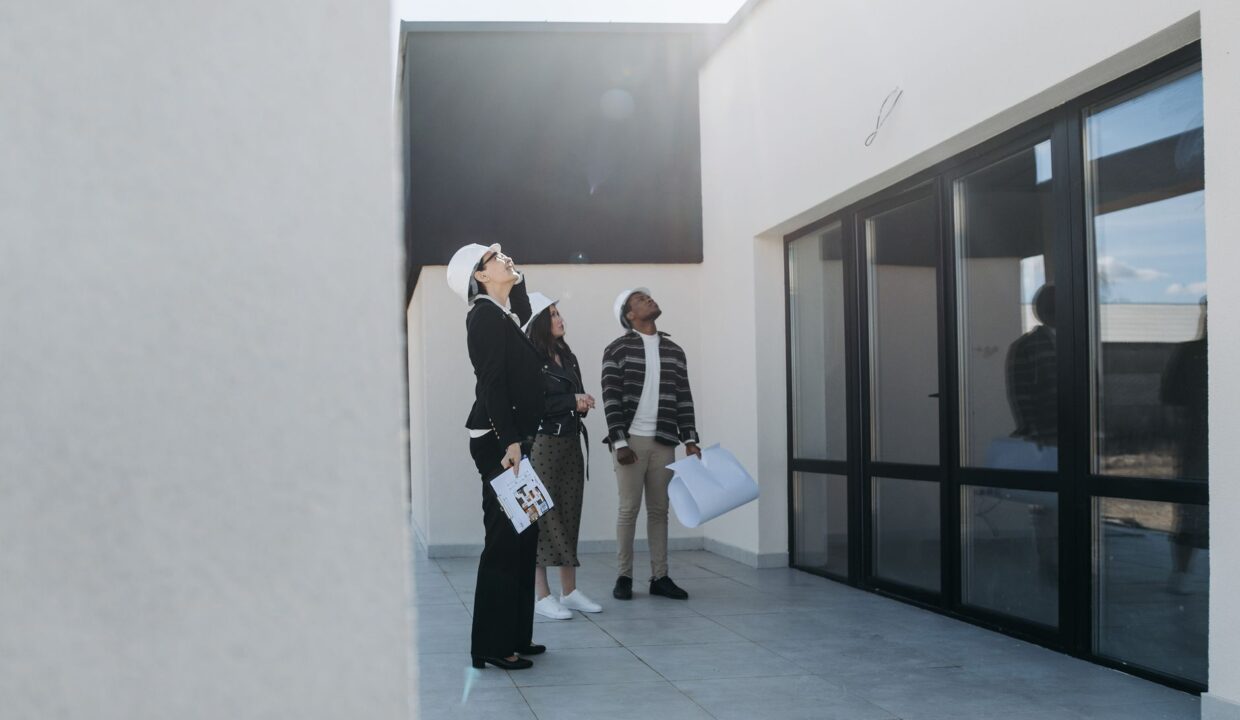 Home appraisal in Kenya: appraiser inspecting a house.