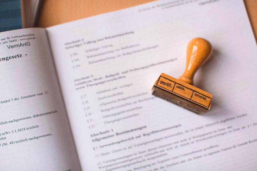 Land title verification documents on desk in Kenyan office.